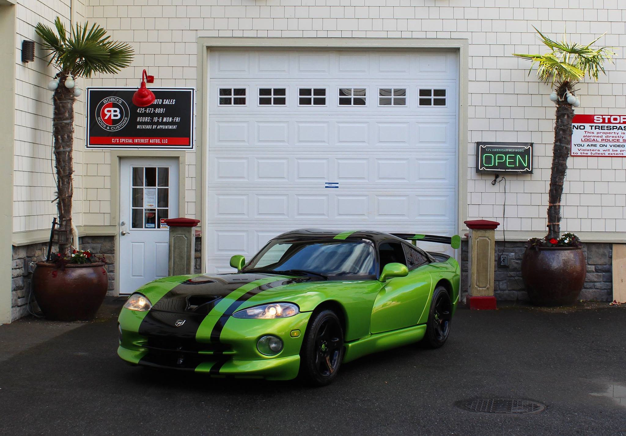 Green Dodge Viper with black stripes outside the former Bobo’s showroom